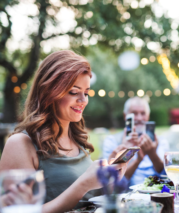 Guest at Wedding scanning QR Code and uploading photo to Every Moment